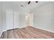 Well-lit bedroom featuring laminate flooring and a double-door closet for ample storage at 1300 Island Green St, Davenport, FL 33896