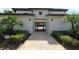 Well-maintained walkway leading through a gated entrance to the community pool area at 1300 Island Green St, Davenport, FL 33896