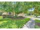 Well-maintained home with a lush lawn and mature trees, situated on a peaceful street at 1300 Island Green St, Davenport, FL 33896