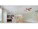Kitchen featuring granite countertops, pendant lighting, dark wood cabinets, and stainless steel appliances at 1300 Island Green St, Davenport, FL 33896