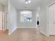 Open living area showcasing tile flooring, neutral walls, and an arched opening to another room at 1300 Island Green St, Davenport, FL 33896