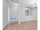 Open living area showcasing tile flooring, neutral walls, and an arched opening to another room at 1300 Island Green St, Davenport, FL 33896