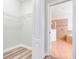 Walk-in closet leading to a bathroom, providing ample storage space at 1300 Island Green St, Davenport, FL 33896