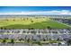 A high angle shows a large residential area, with well-spaced gray homes and an open view at 140 Trinity Ridge Cir, Davenport, FL 33897