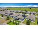 Aerial perspective of a residential neighborhood showcasing well-maintained homes and lush green spaces, ideal for suburban living at 140 Trinity Ridge Cir, Davenport, FL 33897