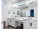 Bright bathroom with double vanity, granite countertops, and modern fixtures at 140 Trinity Ridge Cir, Davenport, FL 33897