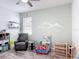 Bright ' room with a ceiling fan and cozy reading nook at 140 Trinity Ridge Cir, Davenport, FL 33897