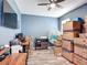 Multi-purpose room with a hanging chair and plenty of storage boxes at 140 Trinity Ridge Cir, Davenport, FL 33897