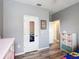 Comfortable bedroom featuring a mirror door, complemented by stylish decor at 140 Trinity Ridge Cir, Davenport, FL 33897