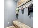 Inviting entryway with bench seating and convenient wall hooks for storage at 140 Trinity Ridge Cir, Davenport, FL 33897