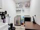 Practical laundry room equipped with modern appliances and shelving units at 140 Trinity Ridge Cir, Davenport, FL 33897