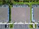 Overhead view of modern townhomes with parking, pools, and well-maintained green spaces at 1425 Serendipity Ln, Clermont, FL 34714