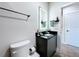 Contemporary bathroom features illuminated mirror, granite countertop, and modern fixtures at 1425 Serendipity Ln, Clermont, FL 34714