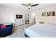 Well-appointed bedroom featuring ceiling fan, TV and ample storage, adding practical style at 1425 Serendipity Ln, Clermont, FL 34714