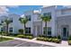Modern townhome facade features stone details, lush greenery, and a well-maintained exterior at 1425 Serendipity Ln, Clermont, FL 34714