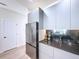 The modern kitchen features stainless steel appliances, sleek cabinets, and ample counter space at 1425 Serendipity Ln, Clermont, FL 34714