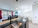 Contemporary open-concept kitchen flows into a well lit living and dining area, great for entertaining at 1425 Serendipity Ln, Clermont, FL 34714