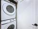 Stackable Samsung washer and dryer located inside closet adding convenience and maximizing space at 1425 Serendipity Ln, Clermont, FL 34714