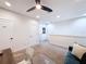 Bright living room with plush carpeting, access to doors, and comfortable blue couch at 1425 Serendipity Ln, Clermont, FL 34714