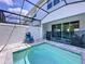 Relaxing screened-in pool area with lounge chairs and access to the home's interior at 1425 Serendipity Ln, Clermont, FL 34714