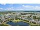 Expansive aerial view showing the community's peaceful setting with lakes and numerous homes at 1490 Olive Ct, St Cloud, FL 34771