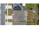 Birds-eye view showcasing the property's roof, driveway, and a spacious backyard, nestled in a residential neighborhood at 1490 Olive Ct, St Cloud, FL 34771