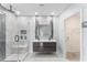 Modern bathroom with dual sinks, a glass-enclosed shower, and a walk-in closet at 1490 Olive Ct, St Cloud, FL 34771