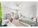 Bright bedroom featuring plush carpet, ceiling fan, and plenty of natural light at 1490 Olive Ct, St Cloud, FL 34771