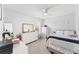 Well-lit bedroom with a plush carpet, plenty of storage, and a comfortable bed at 1490 Olive Ct, St Cloud, FL 34771