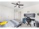 This bedroom features a ceiling fan, carpet flooring, and white walls at 1490 Olive Ct, St Cloud, FL 34771