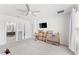 Spacious bedroom, temporary boxes in sight, provides access to a modern bathroom with dual sinks and a walk-in shower at 1490 Olive Ct, St Cloud, FL 34771