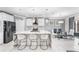 Modern kitchen with stainless steel appliances, a stylish island, and a connected dining area at 1490 Olive Ct, St Cloud, FL 34771