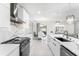 Contemporary kitchen with sleek white cabinets, stainless steel appliances, and a spacious design at 1490 Olive Ct, St Cloud, FL 34771