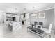 Bright kitchen featuring a large island, modern appliances, and a dining area, perfect for Gathering meals at 1490 Olive Ct, St Cloud, FL 34771