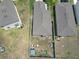 Aerial view of the property showcasing the backyard, fenced perimeter, and surrounding neighborhood at 2034 Old Pasture Ln, Lakeland, FL 33801