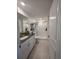 Clean, modern bathroom with granite countertop vanity and walk-in shower at 2034 Old Pasture Ln, Lakeland, FL 33801