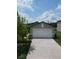 Charming single-story home with a two-car garage and a well-maintained lawn at 2034 Old Pasture Ln, Lakeland, FL 33801