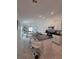 Bright kitchen features granite counters, breakfast bar, and modern white cabinets at 2034 Old Pasture Ln, Lakeland, FL 33801