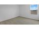 Corner of a bedroom with plush carpet, white walls and window at 227 Bull Frog Ln, Umatilla, FL 32784