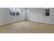 This bright bedroom features tile flooring and natural light streaming through windows at 227 Bull Frog Ln, Umatilla, FL 32784