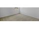 Corner of a bedroom with plush carpet, white walls and window at 227 Bull Frog Ln, Umatilla, FL 32784