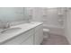 Bright bathroom featuring double sinks with quartz countertops, white cabinets, and a shower-tub combo at 232 Flag Lilly Ln, Umatilla, FL 32784