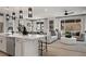 Open-concept living space featuring hardwood floors, modern lighting, and comfortable seating at 232 Flag Lilly Ln, Umatilla, FL 32784