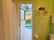 Bathroom view to the screened-in pool deck showing an exit door for convenience at 240 Steamboat Blvd, Davenport, FL 33897