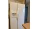 Side by side refrigerator with water and ice dispenser in an all white kitchen at 240 Steamboat Blvd, Davenport, FL 33897
