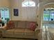 Cozy living room featuring comfortable seating, neutral decor, and ample natural light at 240 Steamboat Blvd, Davenport, FL 33897