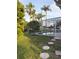 Tranquil pool surrounded by lush greenery and majestic palms, creating a serene outdoor oasis at 240 Steamboat Blvd, Davenport, FL 33897