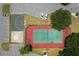 Aerial view of a tennis court, a volleyball court, a parking lot and some green spaces at 2438 Sweetwater Club Cir # 50, Kissimmee, FL 34746