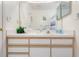 Bright bathroom with a white countertop vanity, faucet, and drawers with a mirror at 2438 Sweetwater Club Cir # 50, Kissimmee, FL 34746