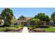 Attractive single-story building featuring well-maintained landscaping with mature trees and convenient parking at 2438 Sweetwater Club Cir # 50, Kissimmee, FL 34746